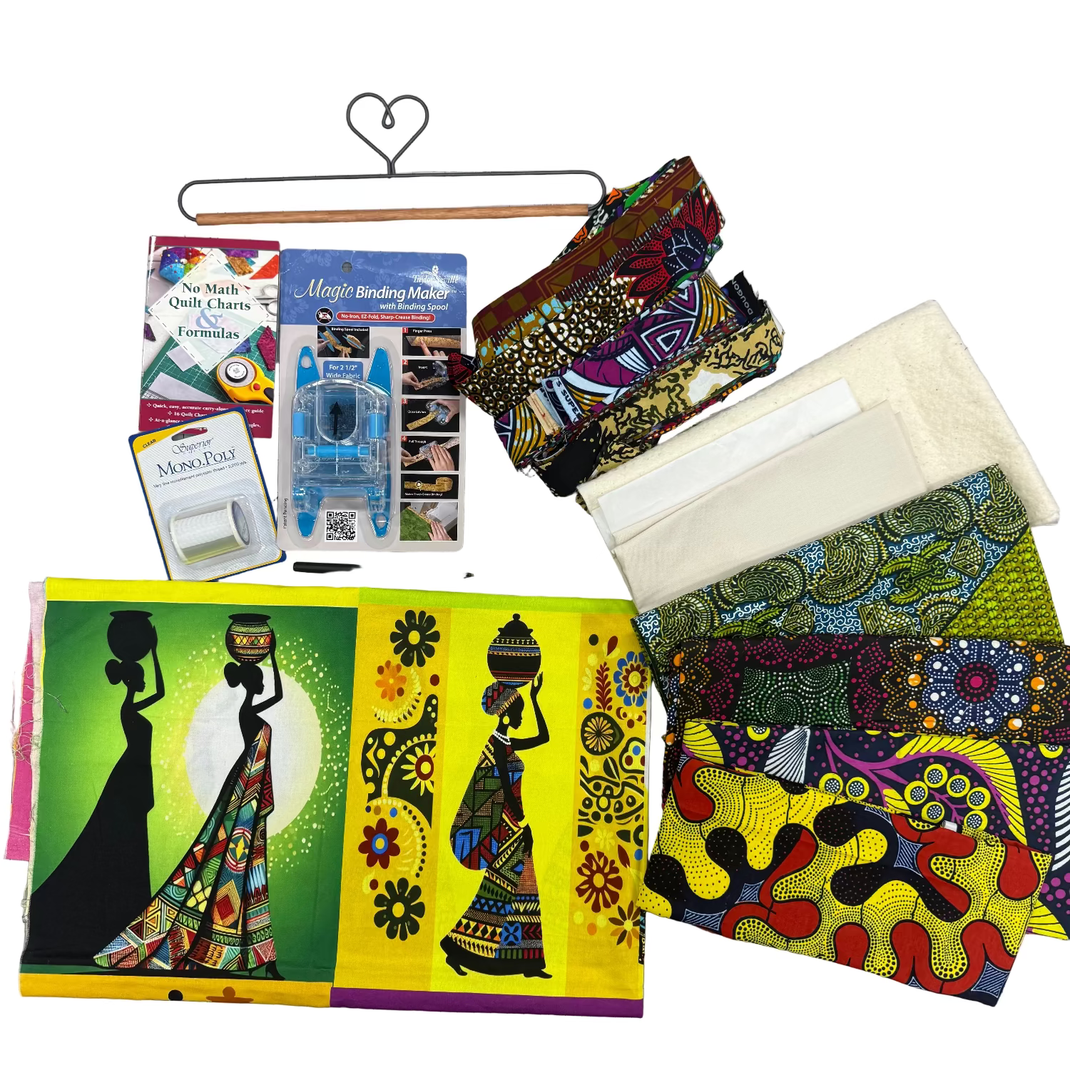 Colorful fabric samples and sewing tools on a cutting mat with ruler