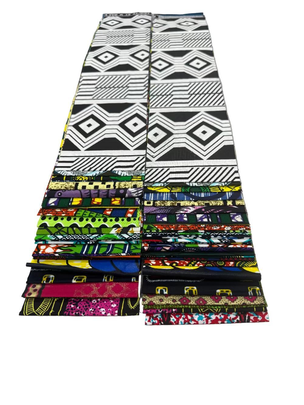 Stack of colorful fabric strips on a cutting mat with measurements.